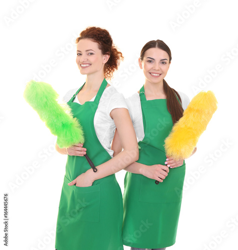 Cleaning staff in green apr...