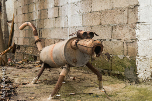 Strange dog sculpture made of scrap metal