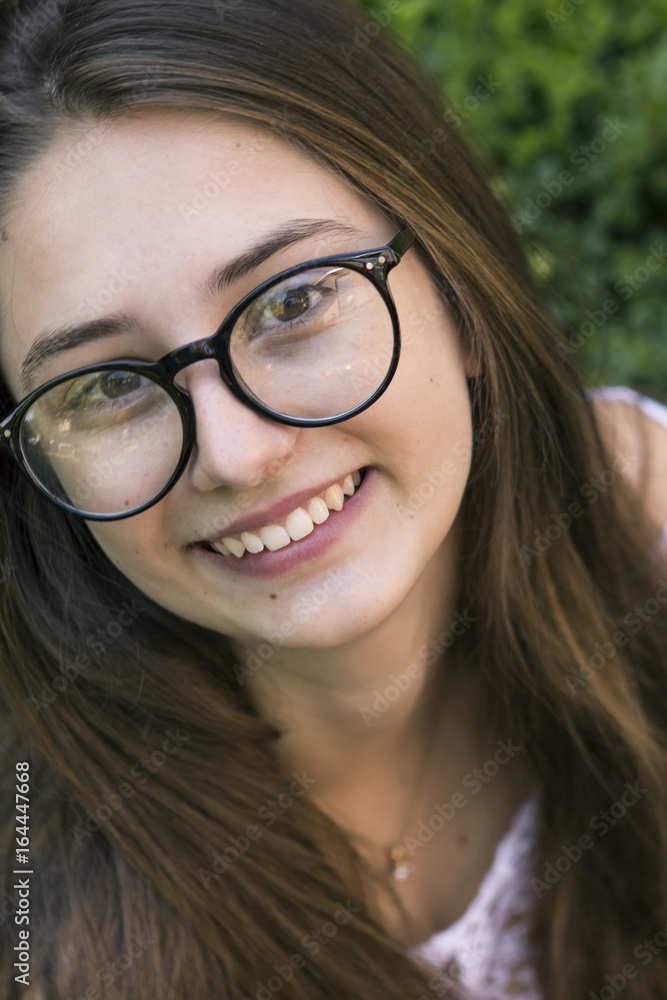 Portrait of a young innocent girl with glasses Portrait of a young innocent girl with glasses
