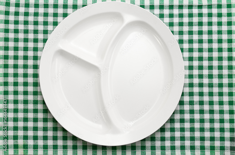 Empty serving tray for food on tablecloth. Concept of school lunch Empty serving tray for food on tablecloth. Concept of school lunch