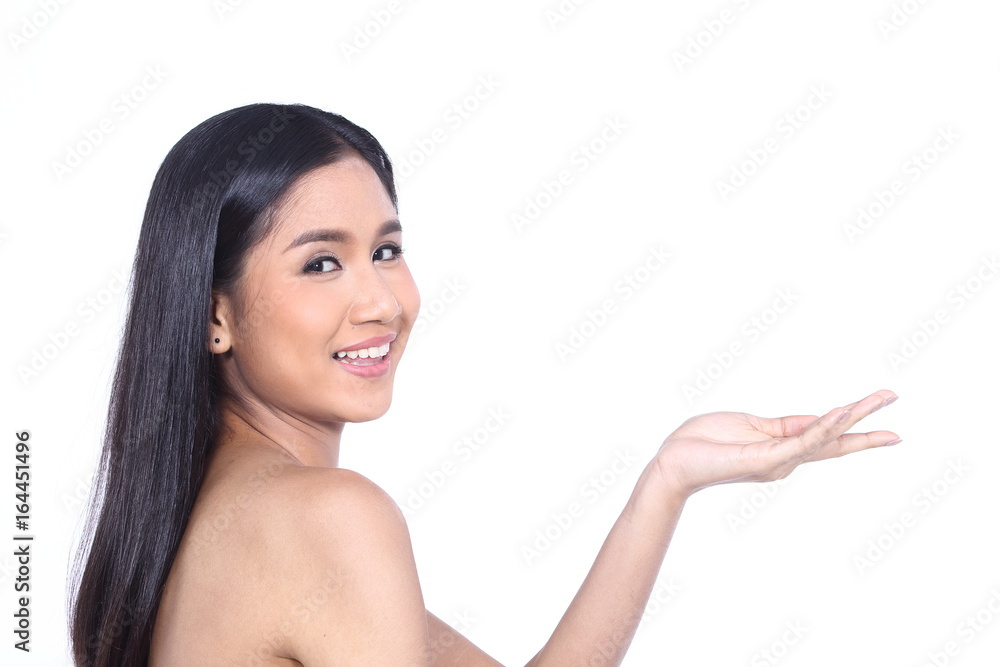 Beautiful Asia Thai woman with black hair face close up portrait studio on white, showing empty palm with copy space Beautiful Asia Thai woman with black hair face close up portrait studio on white, showing empty palm with copy space