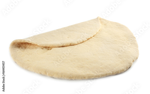 Rolled raw dough on white background