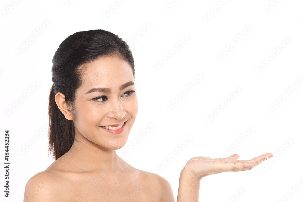 Beautiful Asia Thai woman with black hair, open shoulder and smile, face close up portrait studio on white, showing empty palm with copy space Beautiful Asia Thai woman with black hair, open shoulder and smile, face close up portrait studio on white, showing empty palm with copy space