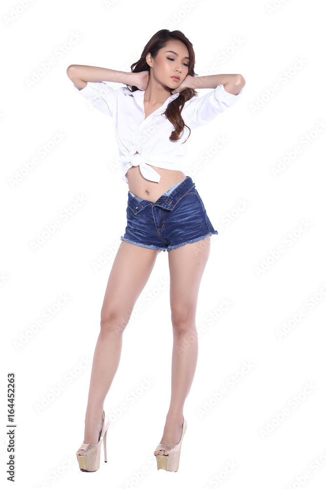 Young Asia Girl Curl Hair, White Shirt, Short Jean, open belly, full body isolated on white background Young Asia Girl Curl Hair, White Shirt, Short Jean, open belly, full body isolated on white background