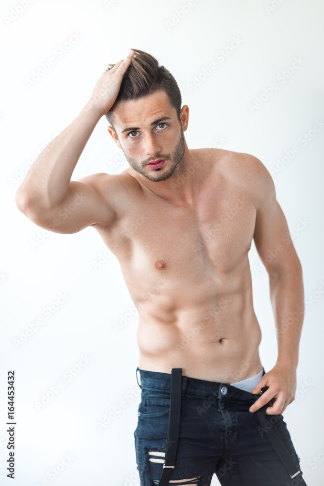 Sexy muscular shirtless man touching his hair Sexy muscular shirtless man touching his hair