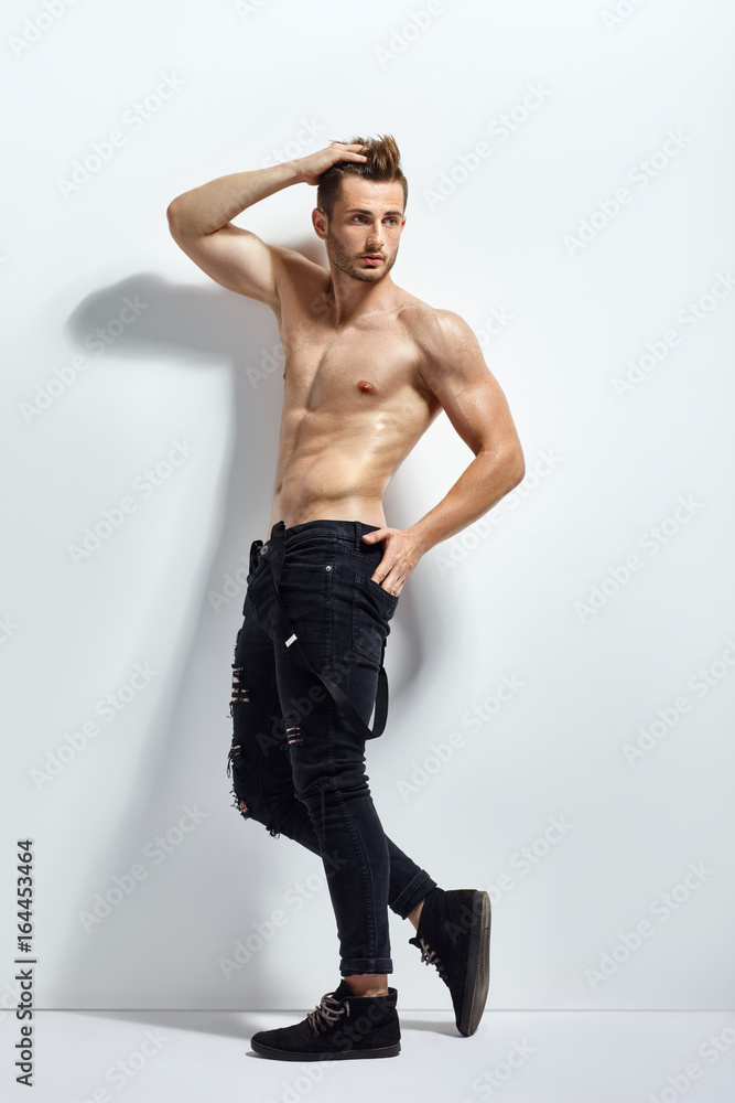 Fototapeta premium Full length portrait of a sexy muscular shirtless man