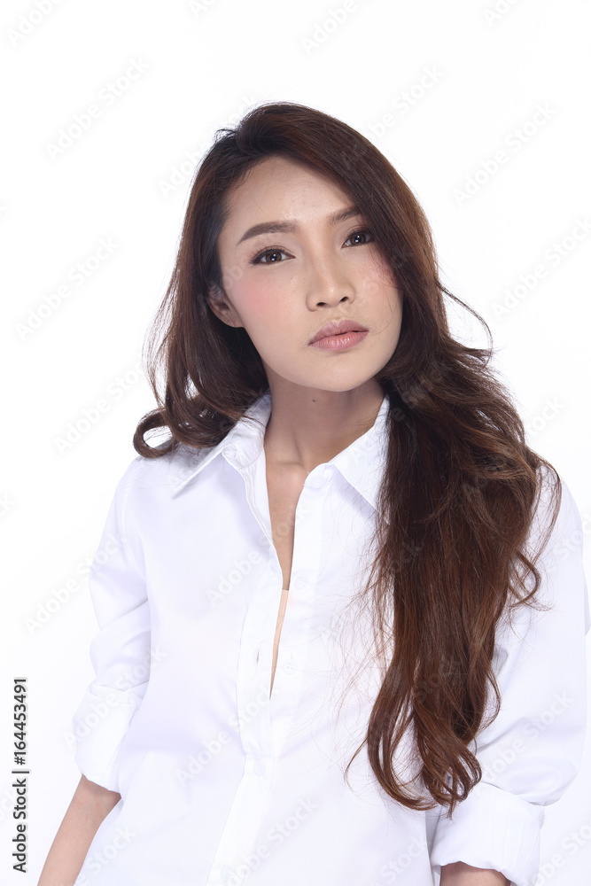 Perfect Healthy Female Model with Natural Beauty Clean Look Fashion Make Up style in White Shirt, long hair, White Background in Studio Lighting, the concept of health, smile Face Perfect Healthy Female Model with Natural Beauty Clean Look Fashion Make Up style in White Shirt, long hair, White Background in Studio Lighting, the concept of health, smile Face
