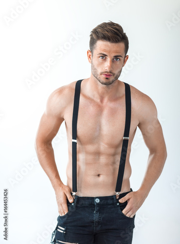 Картината върху платно Sexy muscular shirtless man in suspenders
