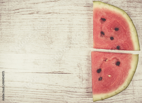 Watermelon on wooden background.