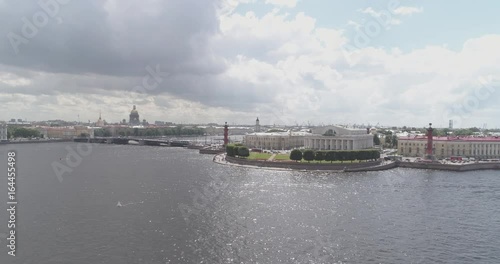 Aerial low altitude side fly over St. Petersburg neva with view of Stock Market Square and bridges in summer day photo