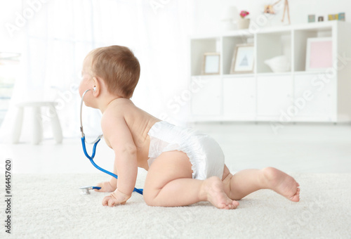 Cute little baby playing wi...