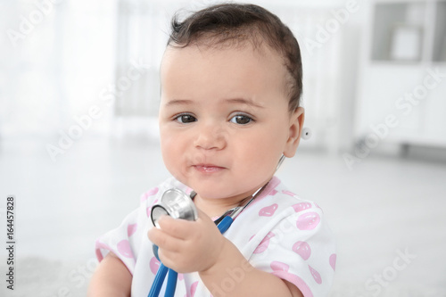 Cute little baby playing wi...