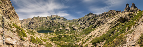 Panoramic view of Lac de Melo and mountain peaks in Corsica