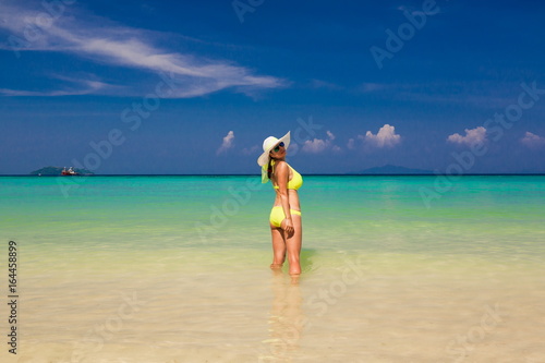 Thailand. Woman sea, bikini, hat, back. Sea background