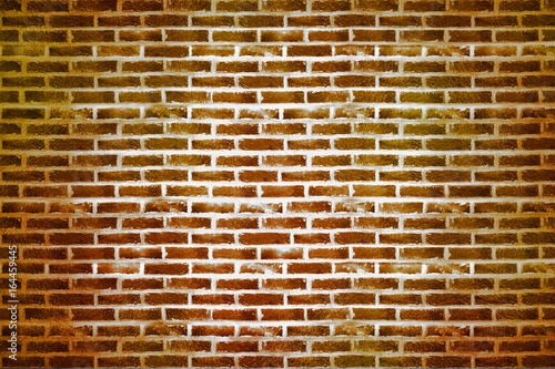 Gold brick wall texture or background. A wall of shiny gold blocks