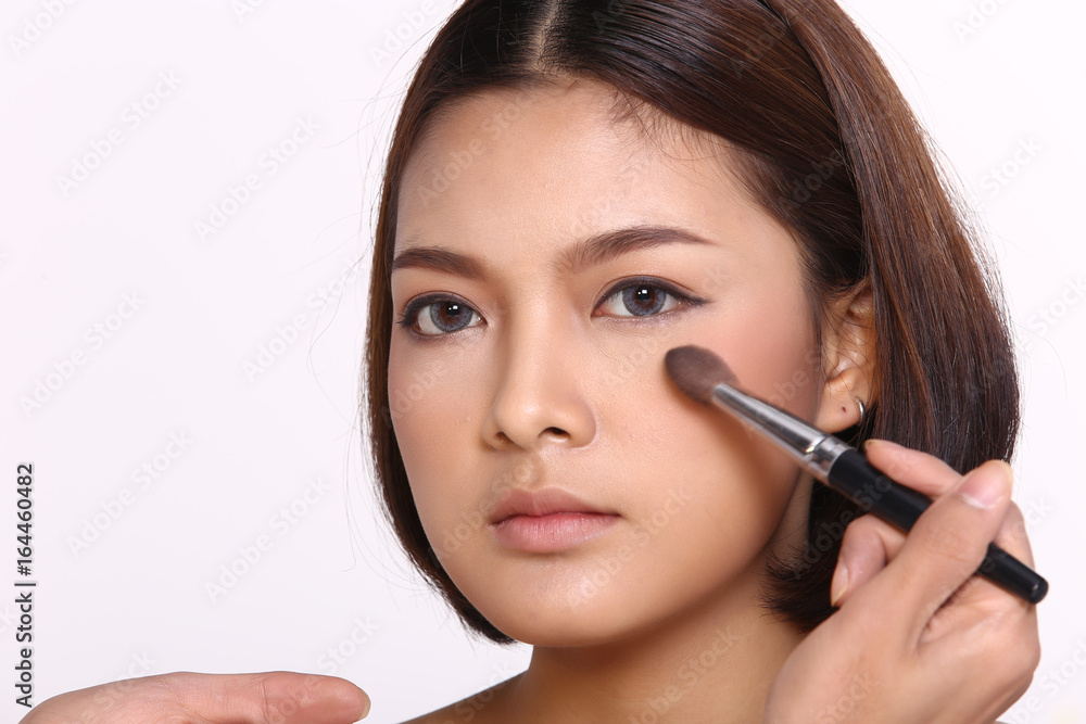 Cosmetic, Applying Make up, Beauty Process, white studio background, Perfect Healthy Skin, Powder brush and palette on cheek Cosmetic, Applying Make up, Beauty Process, white studio background, Perfect Healthy Skin, Powder brush and palette on cheek