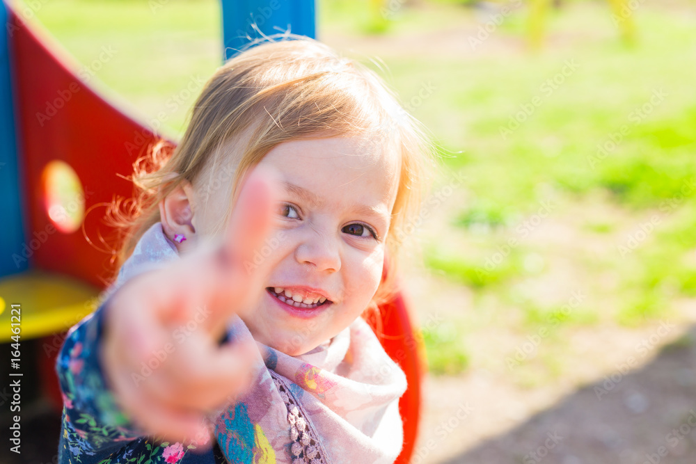 happy child girl showing thumbs up happy child girl showing thumbs up