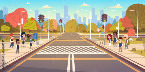 Group Of School Children Waiting For Green Traffic Light To Cross Road On Crosswalk Flat Vector Illustration photo