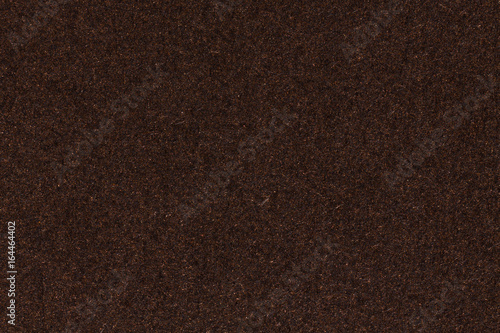 Photograph of artist's coarse grain dark brown pastel paper texture sample.