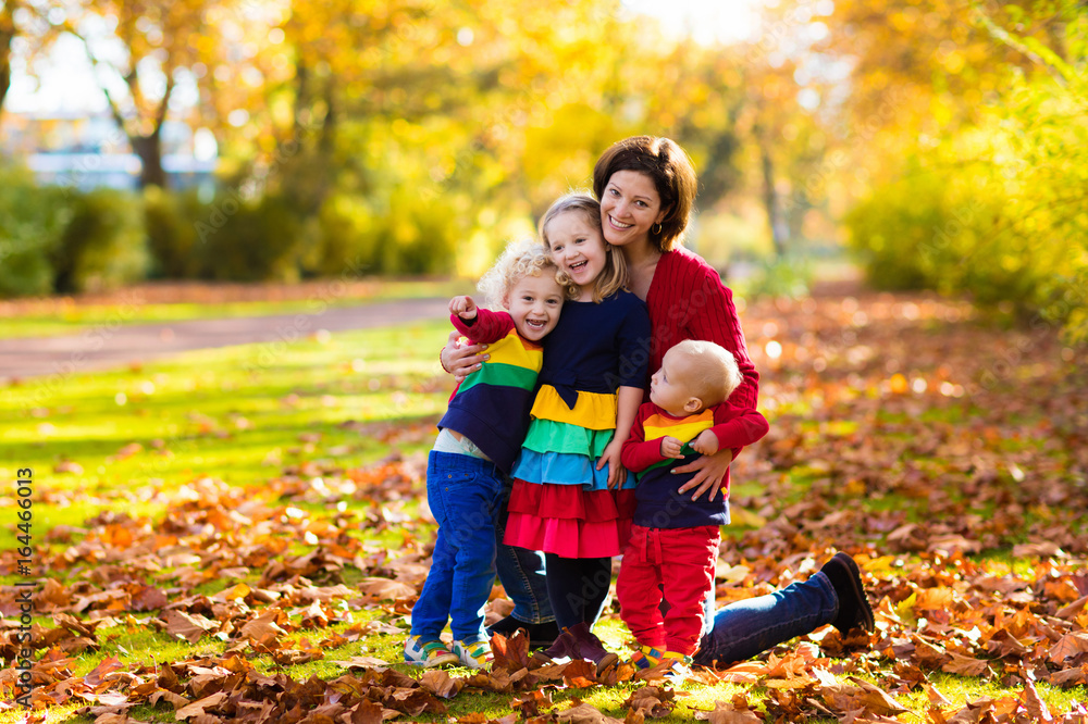 Mother and kids in autumn park Mother and kids in autumn park