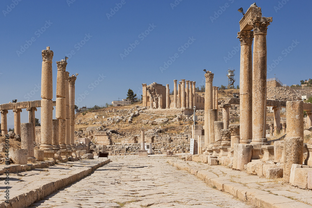 Colonnaded Street in Jerash with the temple of Zeus in the background Colonnaded Street in Jerash with the temple of Zeus in the background