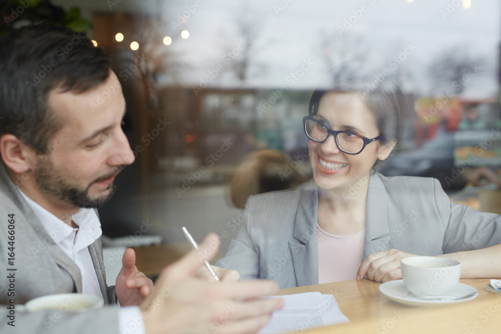 Businessman discussing resume of applicant at interview Businessman discussing resume of applicant at interview