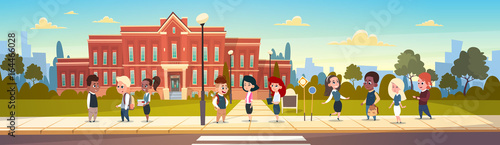 Group Of Pupils Mix Race Stand In Front Of School Building Primary Schoolchildren Talking Students Flat Vector Illustration