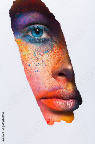 Face of model with colorful art make-up, close-up