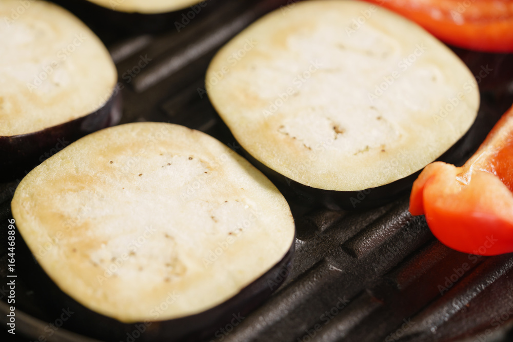 cooking eggplant and pepper on grill pan cooking eggplant and pepper on grill pan