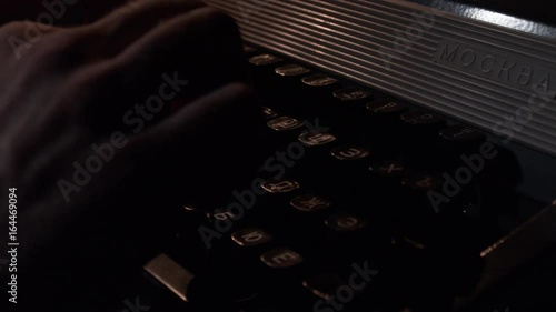 Hands typing on vintage typewriter. Close up of man typing with old typewriter. Typewriter photo