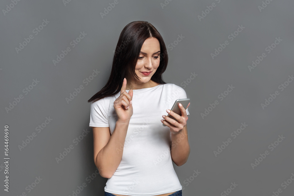 Young woman typing message on smartphone Young woman typing message on smartphone