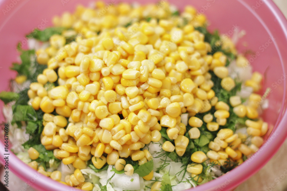Fresh salad with canned corn, cabbage and parsle Fresh salad with canned corn, cabbage and parsle