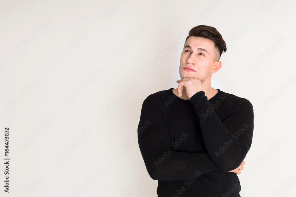 Pensive young man studio portrait, boy style Pensive young man studio portrait, boy style