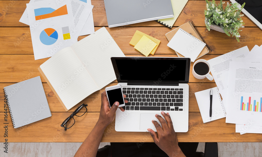 African-american businessman at work, table top view African-american businessman at work, table top view