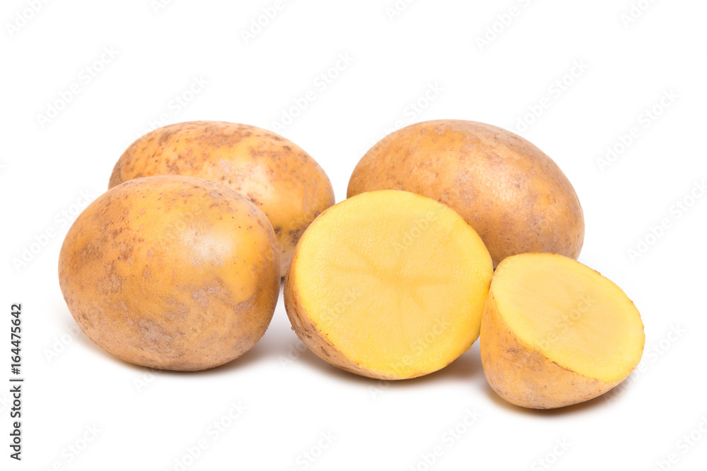 Vegetables potatoes in a cut and whole form on a white background Vegetables potatoes in a cut and whole form on a white background
