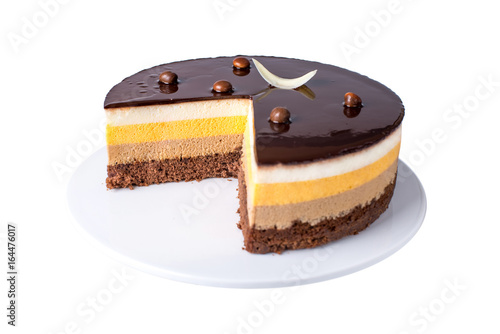Isolated orange chocolate cake with layers of delicate souffle, a Delicious homemade dessert.