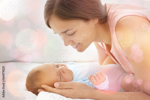 Portrait of young mother an...