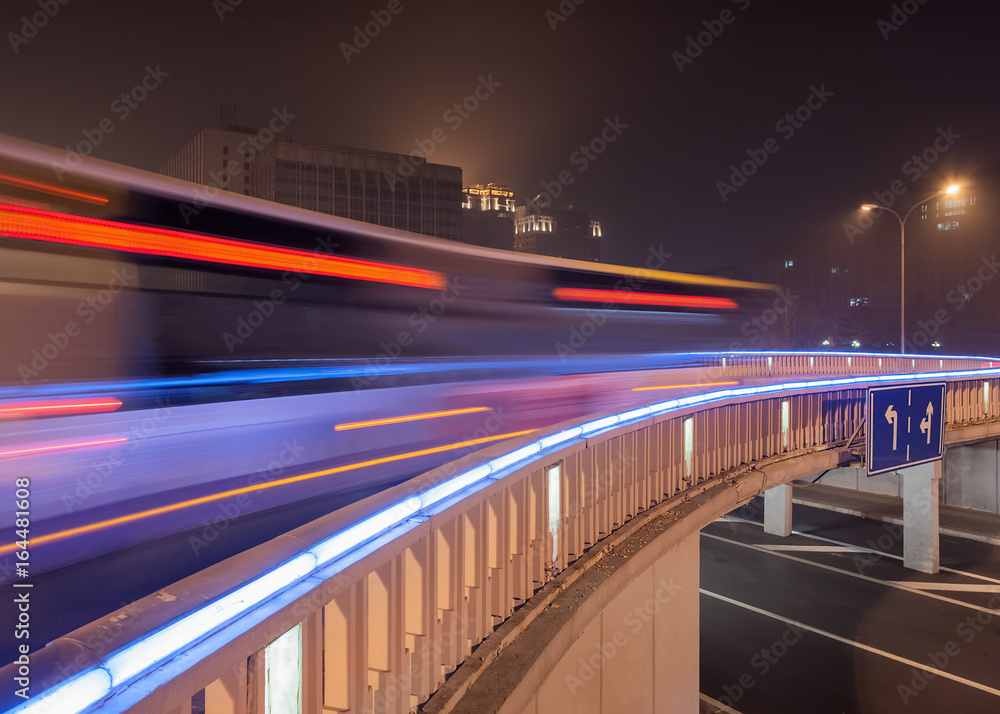 Night scene with illuminated bridge and traffic in motion blur, Beijing center, China