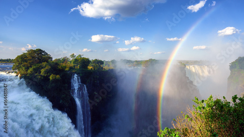 Panoramic view of the Victoria Falls and a unique vertical rainbow, Zimbabwe. (UHD 4K 16x9)