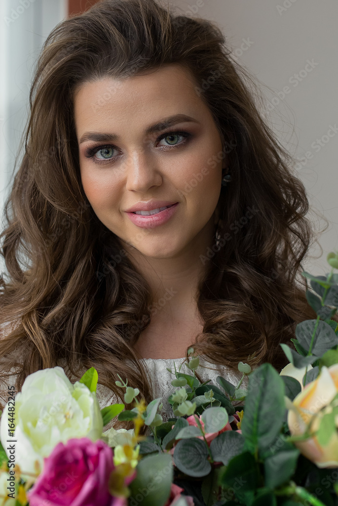 CLose up of portrait of attractive woman with chic fresh bouquet of roses. Lady with floral composition. Happy girl with flowers. CLose up of portrait of attractive woman with chic fresh bouquet of roses. Lady with floral composition. Happy girl with flowers.