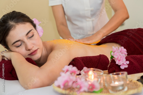 Thai Spa therapy with orange salt scrub on Woman