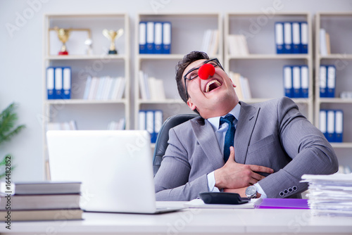Принти на полотні Clown businessman having fun in the office