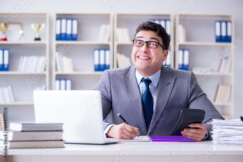 Funny businessman clown acting silly in the office