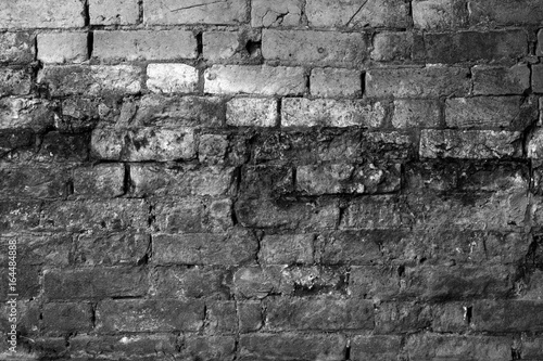 Black and white brick wall with high contrast blue filter
