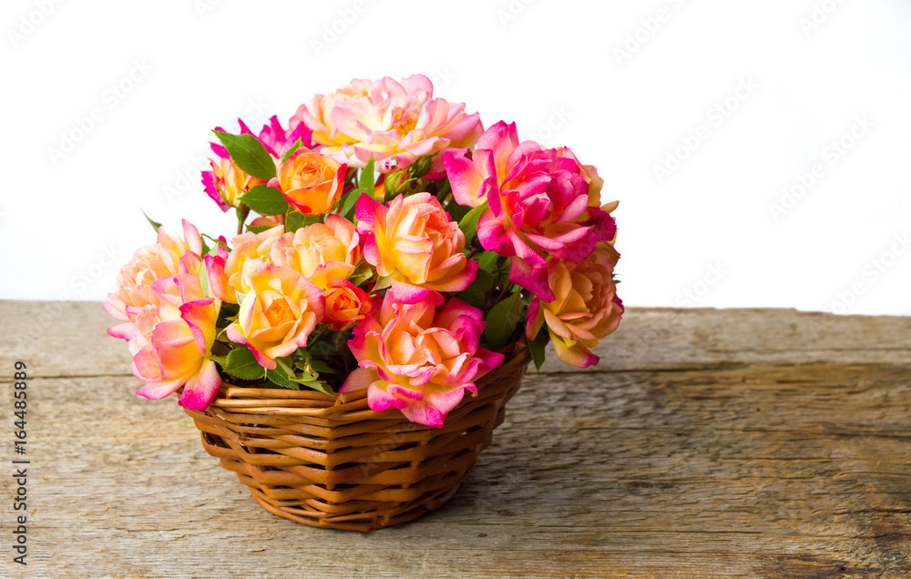 Fresh roses in a wicker basket Fresh roses in a wicker basket