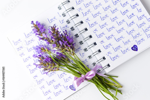 Lavender flowers bouquet on open notebook