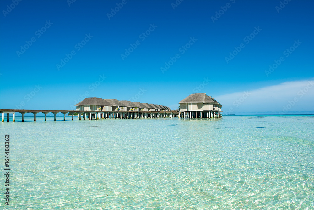 Wooden villas over water of the Indian Ocean, Maldives