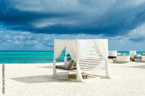 Fototapeta Naklejka Na Ścianę i Meble -  Chill lounge zone on the sandy beach, Maldives island