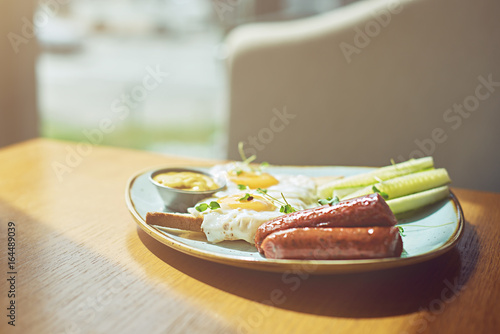 food background of hotel breakfast of eggs and sousages photo