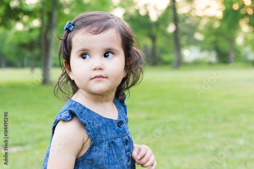 Little girl in a blue denim dress
